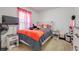 Bright bedroom features carpeted floors, TV, and window with sheer pink curtains at 10 Pine Track Trl, Ocala, FL 34472