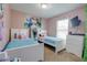 Cozy bedroom featuring twin beds, bright decor, and a window for natural light at 10 Pine Track Trl, Ocala, FL 34472