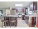 Well-equipped kitchen with stainless steel appliances, granite countertops, and a breakfast bar at 10 Pine Track Trl, Ocala, FL 34472