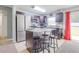 Bright kitchen featuring stainless steel appliances, granite countertops, and convenient island seating at 10 Pine Track Trl, Ocala, FL 34472