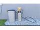 Rain Soft water treatment equipment on a bed of white gravel at 10 Pine Track Trl, Ocala, FL 34472