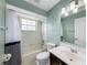 A well-maintained bathroom featuring a tub with shower, single sink vanity, and a bright, clean aesthetic at 1063 Fountainhead Dr, Deltona, FL 32725