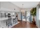 Dining area featuring wood floors, a chandelier, and sliding glass doors to an outdoor space at 1063 Fountainhead Dr, Deltona, FL 32725