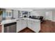 Open kitchen with an island and stainless steel appliances, seamlessly connecting to the living area at 1063 Fountainhead Dr, Deltona, FL 32725