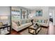 Comfortable living room featuring hardwood floors, two sofas, and views of the outdoors at 1063 Fountainhead Dr, Deltona, FL 32725