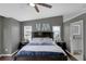 Main bedroom featuring a dark wood bed set and ceiling fan at 1063 Fountainhead Dr, Deltona, FL 32725