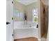 Bathroom featuring a soaking tub with tile surround and shower with tile at 1118 Saint Tropez Ct, Kissimmee, FL 34759