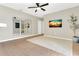 Bedroom features tile flooring, ceiling fan, and decor mirrors at 1118 Saint Tropez Ct, Kissimmee, FL 34759