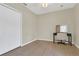 Bedroom with tile floor, double closet doors and a desk with mirror at 1118 Saint Tropez Ct, Kissimmee, FL 34759