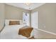 Cozy bedroom with natural lighting, tile floors, and closet at 1118 Saint Tropez Ct, Kissimmee, FL 34759