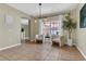 Bright dining area with tile floors, modern light fixture, and sliding glass door at 1118 Saint Tropez Ct, Kissimmee, FL 34759