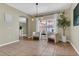 Cozy dining area with modern chairs, neutral colors, and bright windows at 1118 Saint Tropez Ct, Kissimmee, FL 34759