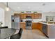 Eat-in kitchen featuring stainless steel appliances and wooden cabinets at 1118 Saint Tropez Ct, Kissimmee, FL 34759