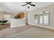 Open-concept living room with stainless appliances and modern mirrors at 1118 Saint Tropez Ct, Kissimmee, FL 34759
