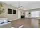 Spacious living room with neutral walls, tile floors, and modern furniture at 1118 Saint Tropez Ct, Kissimmee, FL 34759