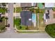 Aerial view of home featuring a large pool, solar panels, and a well-kept yard at 12104 Shallot St, Orlando, FL 32837