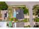 Aerial view of home featuring a large pool, solar panels, and a well-kept yard at 12104 Shallot St, Orlando, FL 32837