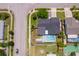 Aerial view of a home with a pool and solar panels, showcasing the property layout and neighborhood at 12104 Shallot St, Orlando, FL 32837