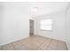 This bedroom offers neutral paint and tile flooring at 12104 Shallot St, Orlando, FL 32837