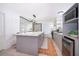 Bright kitchen features stainless steel appliances, spacious island, and gray cabinets at 12104 Shallot St, Orlando, FL 32837