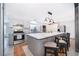 Spacious kitchen with gray-tone cabinets, stainless steel appliances, and a large center island with barstool seating at 12104 Shallot St, Orlando, FL 32837