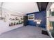 Covered outdoor patio with storage shelves, accent wall, and stainless steel sink at 12104 Shallot St, Orlando, FL 32837
