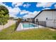 Fenced backyard featuring a private pool, providing a safe and relaxing outdoor oasis for swimming and recreation at 12104 Shallot St, Orlando, FL 32837