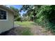 Spacious backyard with ample green space, providing privacy and room for outdoor activities at 1602 W 12Th St, Sanford, FL 32771