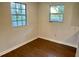Bright bedroom featuring hardwood floors and natural light from a window at 1602 W 12Th St, Sanford, FL 32771