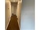 Hallway showcasing hardwood floors connecting to various rooms in the home at 1602 W 12Th St, Sanford, FL 32771