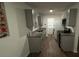 Well-designed kitchen featuring new cabinets, granite countertops, stainless steel appliances, and wood-look floors at 1602 W 12Th St, Sanford, FL 32771