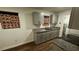 Bright kitchen featuring new cabinets, granite countertops, updated sink, and wood-look floors at 1602 W 12Th St, Sanford, FL 32771