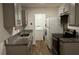Updated kitchen features modern appliances, granite countertops, and gray cabinets at 1602 W 12Th St, Sanford, FL 32771