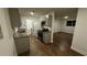 Updated kitchen showcasing new cabinets, granite countertops, stainless steel appliances, and wood-look floors at 1602 W 12Th St, Sanford, FL 32771
