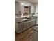Updated kitchen showcasing new cabinets, granite countertops, updated sink, and wood-look floors at 1602 W 12Th St, Sanford, FL 32771