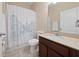 Bathroom featuring a Paris-themed shower curtain, tile flooring, and a single sink at 1703 Leatherback Ln, St Cloud, FL 34771
