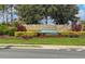 Elegant community entrance sign for The Preserve at Turtle Creek, surrounded by colorful landscaping at 1703 Leatherback Ln, St Cloud, FL 34771