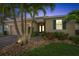 Inviting home exterior with a brick walkway, well-manicured landscaping, and a cozy entrance at 1703 Leatherback Ln, St Cloud, FL 34771