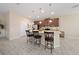 Modern kitchen with an island, pendant lighting, and stainless steel appliances at 1703 Leatherback Ln, St Cloud, FL 34771