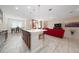 Spacious kitchen with an island, stainless steel appliances, and an open layout to the living room at 1703 Leatherback Ln, St Cloud, FL 34771