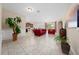 Open-concept living room with tile floors, neutral walls, and a view of the kitchen at 1703 Leatherback Ln, St Cloud, FL 34771