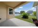 Outdoor patio showcases a serene backyard view with lush greenery and a privacy fence, perfect for relaxation at 1703 Leatherback Ln, St Cloud, FL 34771