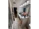 Elegant bathroom featuring double sinks with marble countertops and modern lighting fixtures at 2013 Marilyn Ave, Winter Haven, FL 33881
