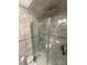 Tiled bathroom featuring a glass-enclosed shower with dual shower heads and convenient in-shower storage at 2013 Marilyn Ave, Winter Haven, FL 33881