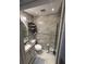 Bathroom boasts tiled walls, a toilet, and a sink with vanity cabinet, offering practical design at 2013 Marilyn Ave, Winter Haven, FL 33881
