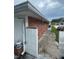 Brick exterior with a narrow walkway leading to the backyard at 2013 Marilyn Ave, Winter Haven, FL 33881