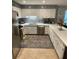 Modern kitchen featuring white cabinets, a mosaic backsplash, and stainless steel appliances at 2013 Marilyn Ave, Winter Haven, FL 33881