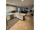 Open kitchen featuring stainless steel appliances and a view to the dining room at 2013 Marilyn Ave, Winter Haven, FL 33881