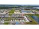 Community aerial view featuring townhomes, green spaces, and scenic neighborhood layout at 2211 Tay Wes Dr, St Cloud, FL 34771