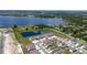 Aerial view of home showcasing community layout with nearby lakes, green spaces, and residential streets at 2211 Tay Wes Dr, St Cloud, FL 34771